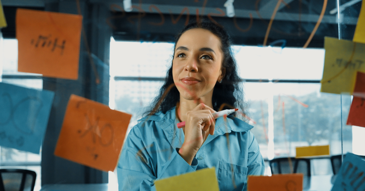marketing director focus on a glass whiteboard